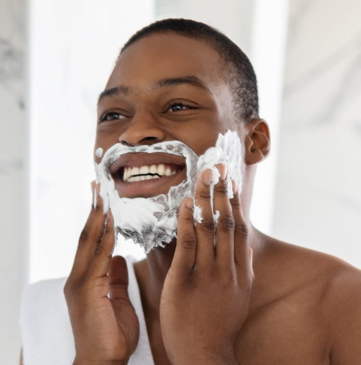 Man passing shaving foam as a representation of the Personal Care product line